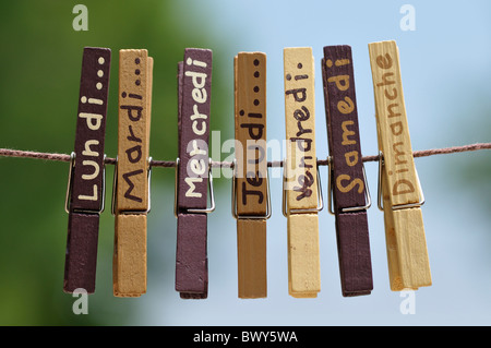 Clothes Pins with Days of the Week on Them Stock Photo