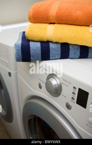 Top View of Clean Towels and Washing Machine at Laundry Room Stock Photo -  Alamy
