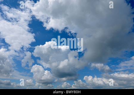 Blue sky covered with white puffy clouds Stock Photo - Alamy