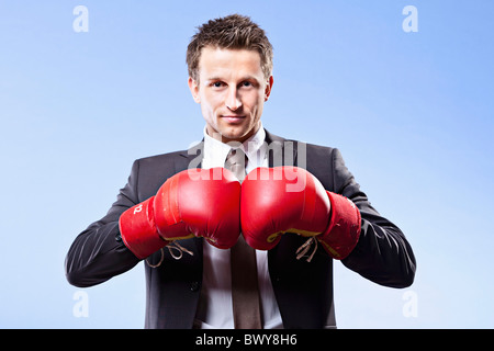 Businessman Wearing Boxing Gloves Stock Photo