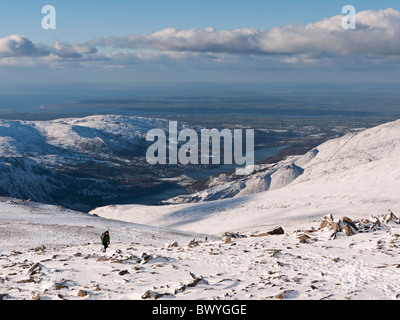 View from the slopes of Glyder Fawr across Llanberis and Llyn Padarn to the Menai Straits and Anglesey. Snowdonia, North Wales Stock Photo