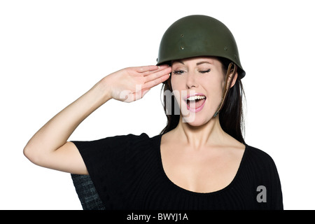 beautiful woman with helmet army soldier saluting on studio isolated background Stock Photo