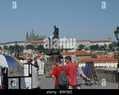 pictures Hradcany Charles bridge no model release pedestrians Prague Prague castle sculpture souvenir stree Stock Photo