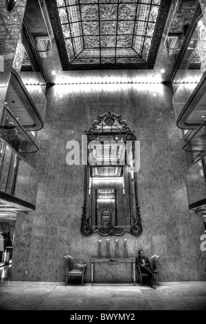 Interior of The Kowloon Regal Hotel, Hong Kong, huge mirrors and stained glass decorate the main entrance Stock Photo