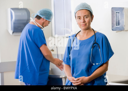 Surgeons scrubbing in before operating Stock Photo