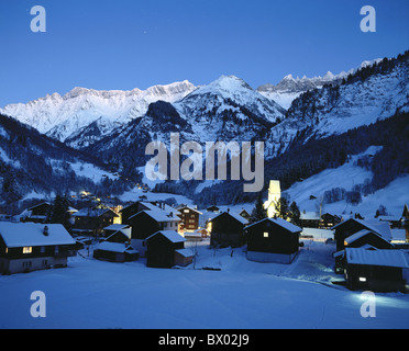 alpine Alps mountains village Elm canton Glarus night at night snow Switzerland Europe winter Stock Photo
