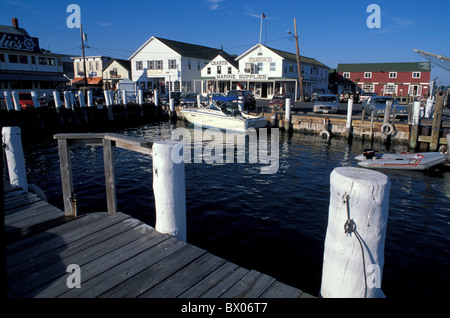 boats coast Greenport harbor jetty Long Island New York pier port sea USA America United States village Stock Photo