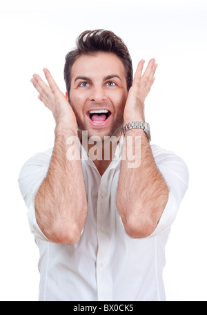 excited man in shirt with both arms up looking surprised - isolated on white Stock Photo