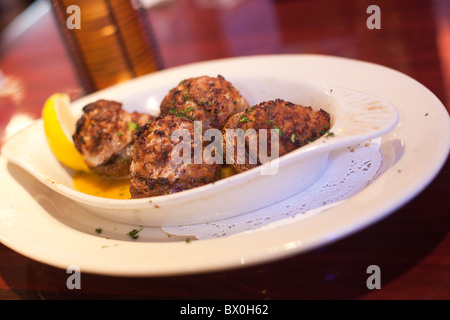 Crabfish-stuffed mushrooms is a popular dish in New Orleans, Louisiana. Stock Photo