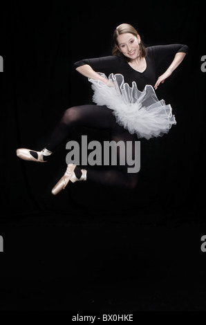 Little Girl in Black Tights Dancing on a Gray Background. Stock Photo -  Image of suit, ballerina: 83896990