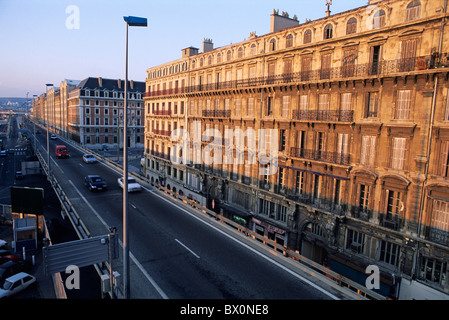 Cars travelling on a highway at sunset, La Joliette, Marseille, France. Stock Photo