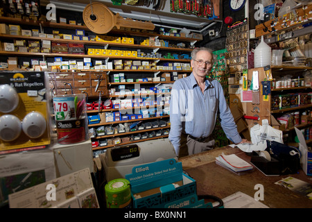Michael Read 62, serving in Gills in Oxford the country's oldest hardware store Stock Photo