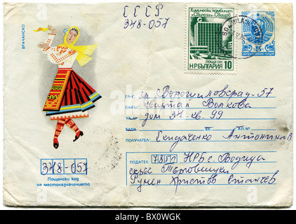 Envelope printed in Bulgaria shows woman in national dress and a postage stamps with images of Bulgarian coat of arms Stock Photo
