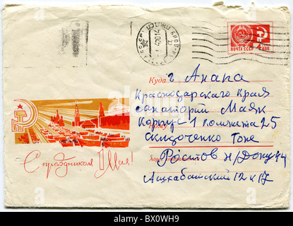 Envelope printed in the USSR honoring 1st of May and a postage stamp with the image of the Soviet emblem Stock Photo