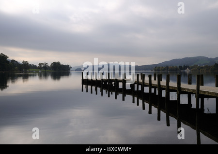 Coniston Water Lake District Cumbria wooden jetty in early morning mist England UK GB Stock Photo