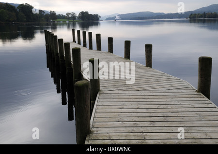 Coniston Water Lake District Cumbria wooden jetty in early morning mist England UK GB Stock Photo