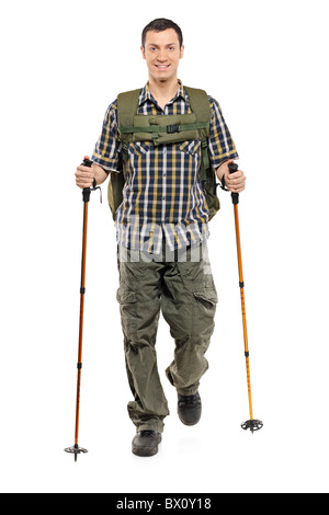 A man in sportswear with backpack and hiking poles Stock Photo