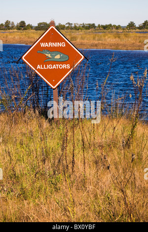 Predators Cation Sign A warning sign at St. Marks National Wildlife Refuge reminds visitors ...