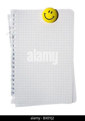 Stack of checked note paper and yellow smiling magnet isolated on white background. Clipping path. Stock Photo