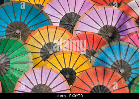 Multicoloured paper umbrellas or parasols on display at  Luang Prabang evening market, Laos Stock Photo