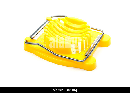 Yellow plastic egg cutter isolated on white background. Studio shot. Stock Photo