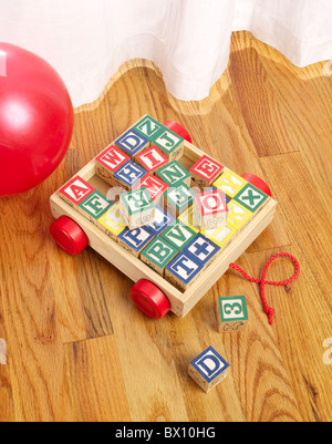 children's wooden blocks on floor vertical Stock Photo