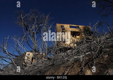 A house burned by a massive forest fire sits in a slope in Kibbutz Beit Oren located in the heart of Carmel mountain range in northern Israel Stock Photo