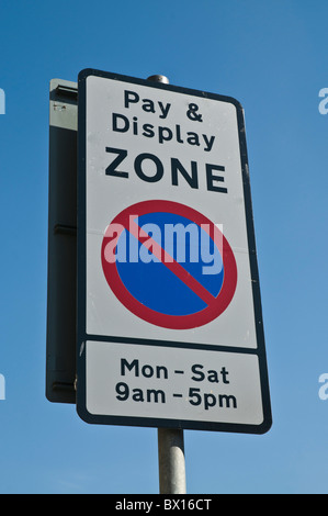 dh  ROADSIGNS UK Pay and Display zone signpost traffic parking restrictions sign uk britain Stock Photo