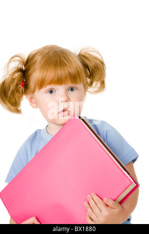 Portrait of small girl with textbook on a white background Stock Photo