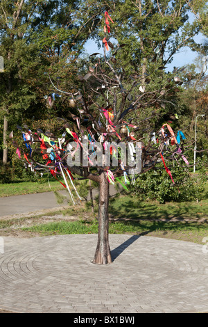 Love and Peace Tree with hundreds of messages written on colorful ribbons in Kiev, Ukraine Stock Photo