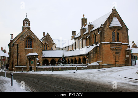 The Alms houses - residence for the poor in Sherborne Dorset covered in snow Stock Photo