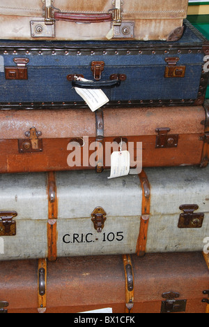 Pile of suitcases on railway platform Stock Photo