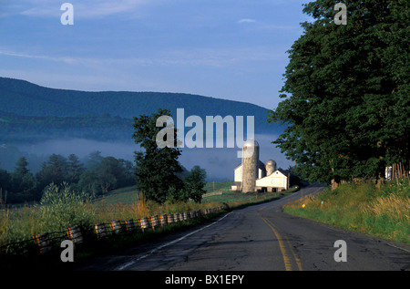 Catskill Mountains near Stamford New York USA America United States farm agriculture silo landscape fog h Stock Photo