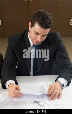 30 years old Lebanese businessman reading report inside office Beirut Lebanon Middle East Stock Photo