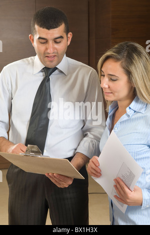 30 years old Middle Eastern businessman talking to a female employee inside office Beirut Lebanon Middle East Stock Photo