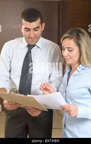 30 years old Middle Eastern businessman talking to a female employee inside office Beirut Lebanon Middle East Stock Photo