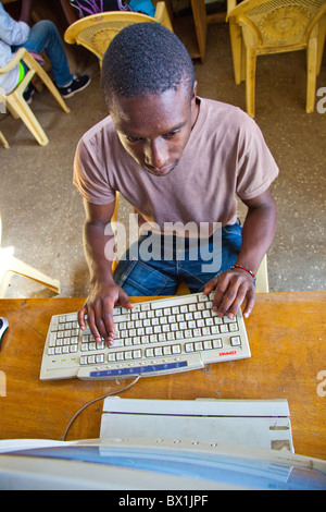 Young man at Maji Mazuri computer training center, Mathare slums, Nairobi Stock Photo