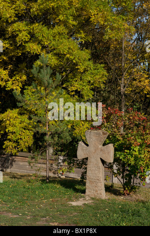 Stone cross at Pyrohovo (State Museum of Folk Architecture and Life of Ukraine) in Kiev, Ukraine Stock Photo