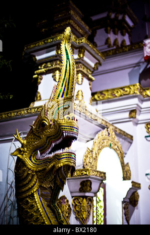 A naga guarding the entrance to a Buddhist temple in Chiang Mai. Stock Photo