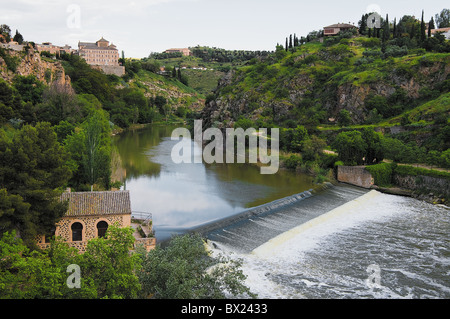 Waterfall on the Tajo river before crossing the San Martin Bridge in the city of Toledo, Castilla la Mancha, Spain, Europe. Stock Photo