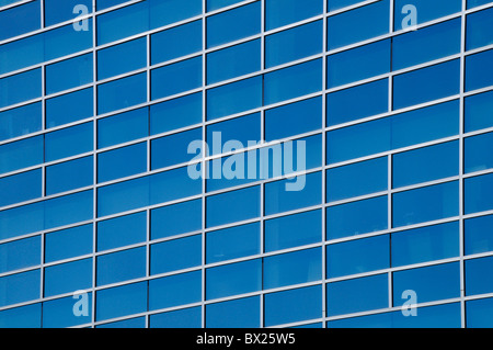 Office building reflecting blue sky Stock Photo - Alamy