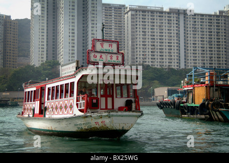 A floating restaurant sits in Aberdeen Harbor, Hong Kong, China, waiting for customers to arrive for lunch. Stock Photo