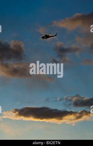 Helicopter in flight at sunset Ekeberg Oslo Norway Stock Photo