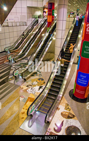 High angle view of escalators at mall in Singapore Stock Photo