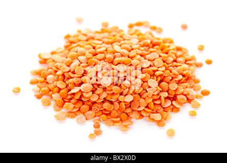 Heap of raw red lentils isolated on white background Stock Photo