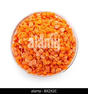 Bowl of uncooked red lentils from above isolated on white background Stock Photo