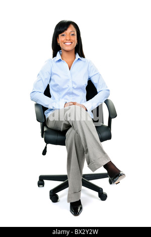 Businesswoman Sitting In Leather Chair With Her Shoes Off Stock Photo