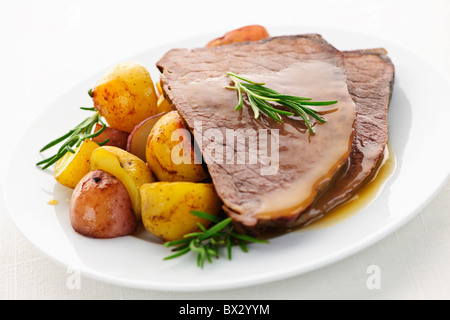 Serving of roast beef and roasted potatoes meal Stock Photo