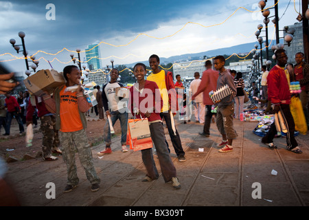 Vendor kids in Meskel Square in Addis Ababa at sunset Stock Photo