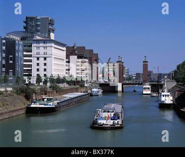 Duisburg Inland harbor harbor port industry ships river inside harbor Lehnkering building swan gate bridge R Stock Photo